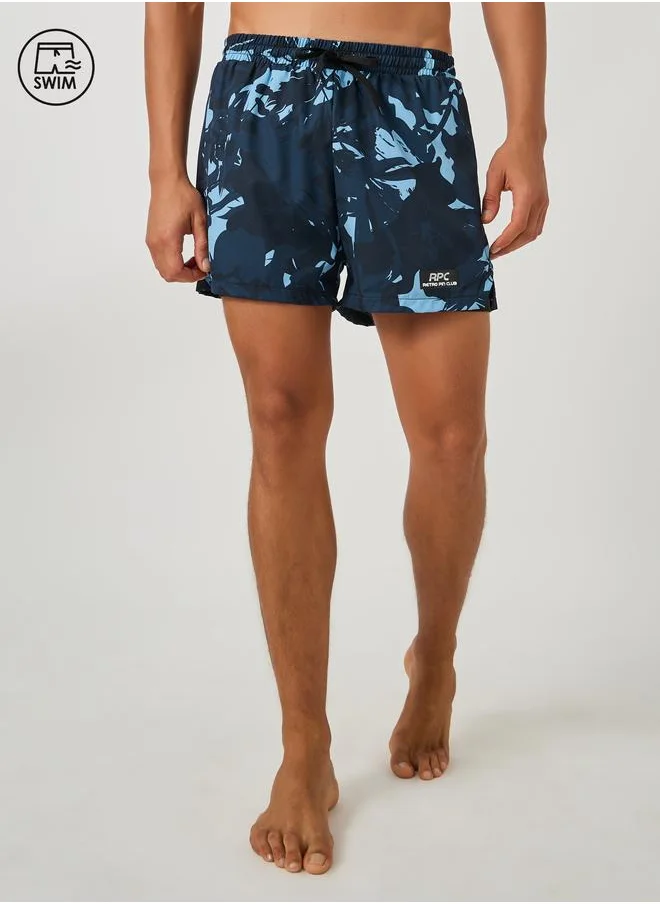 ستايلي Styli Abstract Print Regular Fit Swim Shorts with Badge Detail