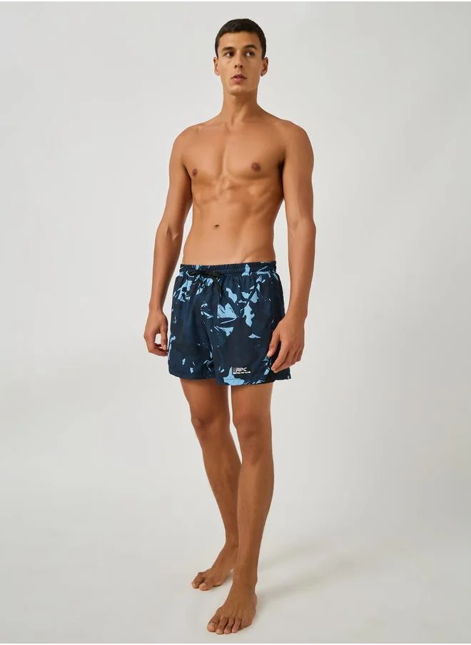 ستايلي Styli Abstract Print Regular Fit Swim Shorts with Badge Detail