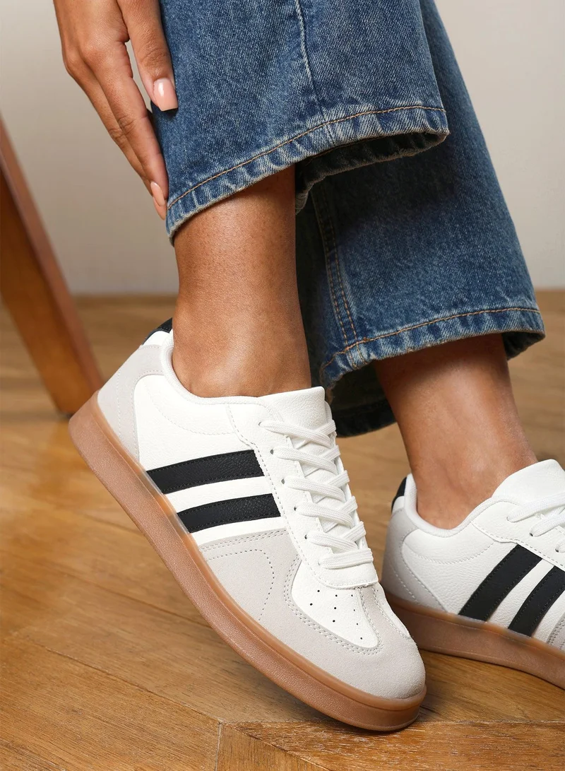 Where's That From 'Xia' Classic retro lace up trainer with stripes