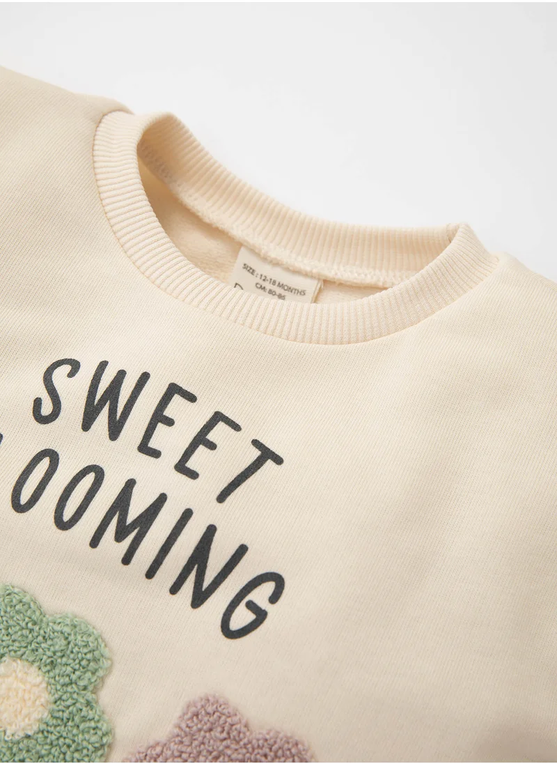 ديفاكتو Ecru Crew Neck Floral Printed Sweatshirt