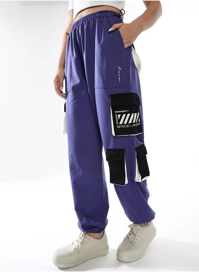هوبرهولمي Women Track Pants in Multicolor featuring Jogger fit with a printed pattern, no sleeves, regular length, secured with elasicated + drawstring closure, crafted from terry – designed to make a statement wherever you go.