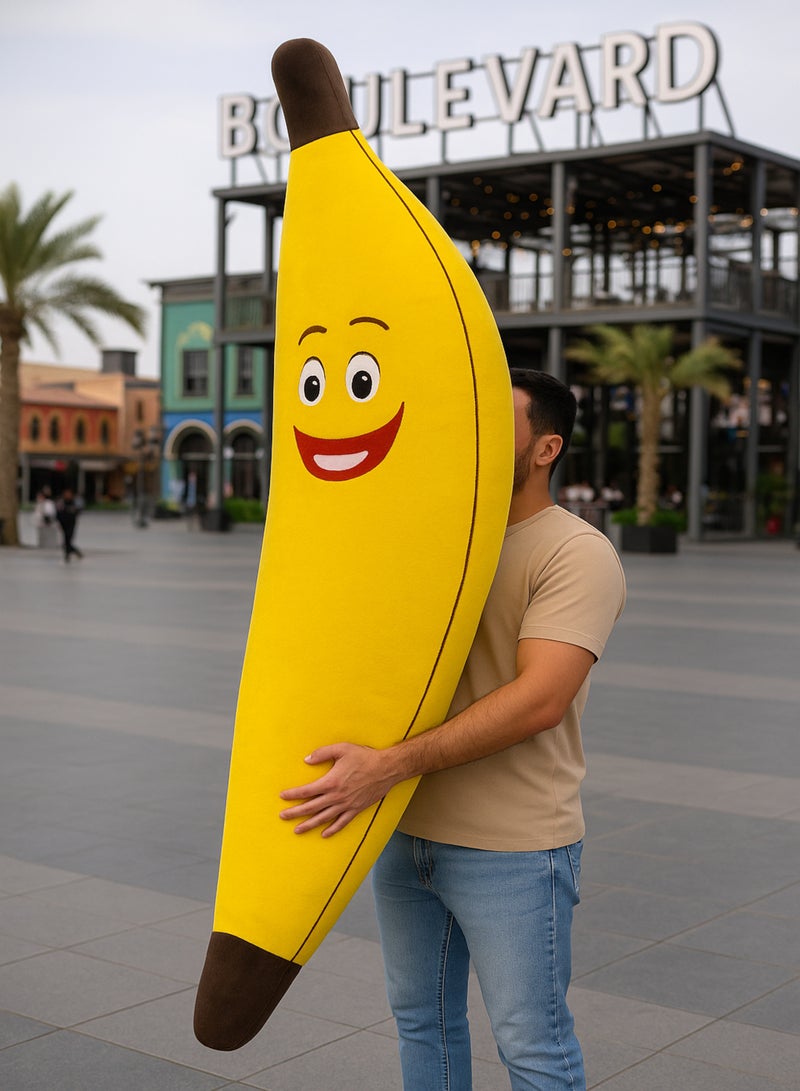 XiuWoo Giant Banana Pillow 180 cm – Soft Fiber-Filled Banana Plush with Funny Emoji Face, Inspired by Riyadh Boulevard Décor, Suitable for Kids’ Rooms, Gifts, Sitting, and Relaxation - Image 1