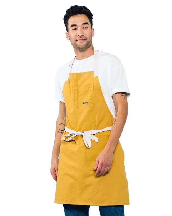 Caldo Daily Cotton Kitchen Apron for Cooking Mens and Womens Professional Chef or Server Bib Apron  Adjustable Straps with Pockets and Towel Loop Mustard