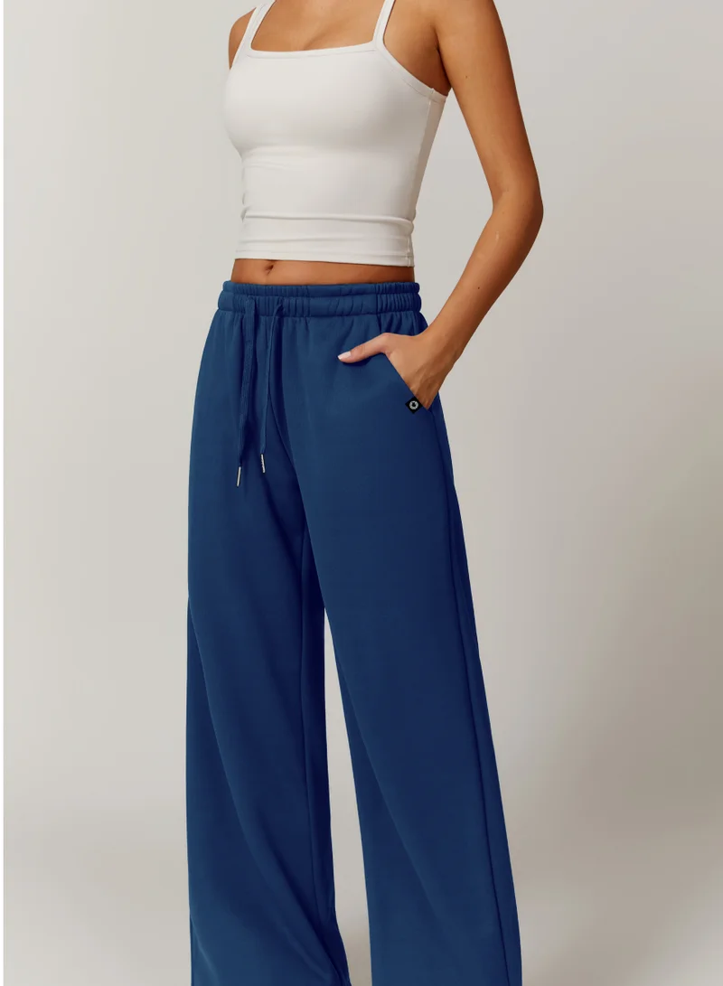 كون.يوغا بنطلون رياضي واسع الساق بخصر متوسط للنساء