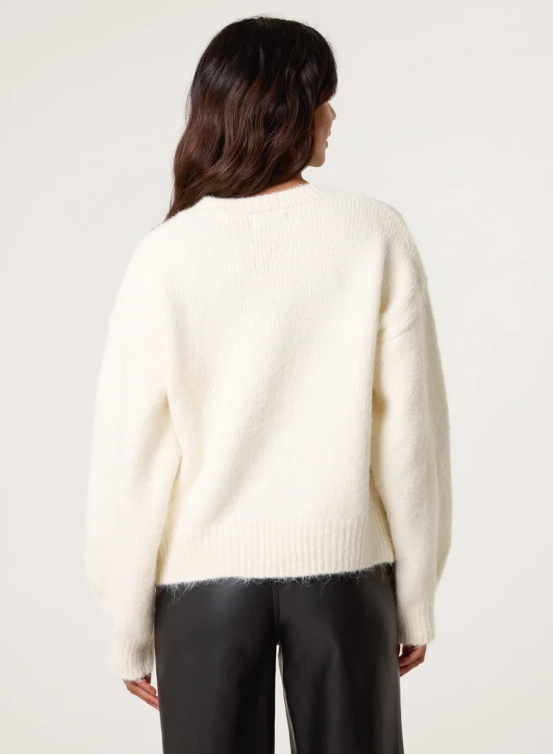 بلو فانيلا كارديجان بأزرار مزين بالترتر الماسي