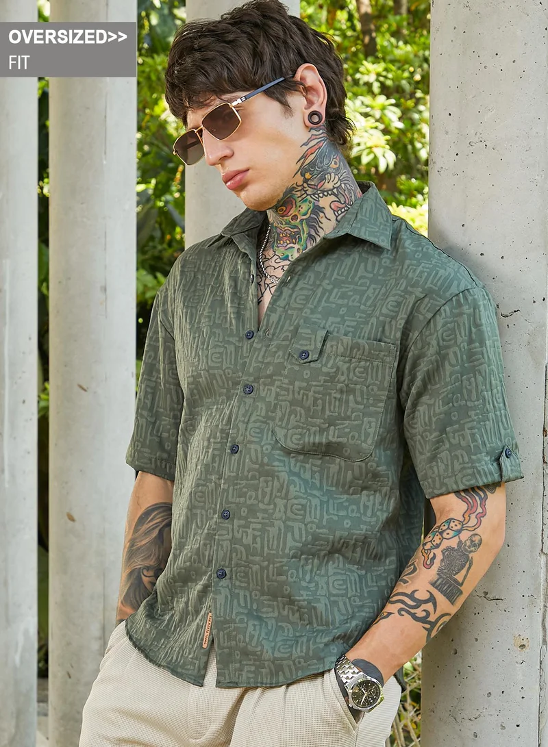 Campus Sutra Campus Sutra Men's Emerald Green Aztec-Tactile Oversized Shirt For Casual Wear | Spread Collar | Short Cuffed Sleeves | Button Closure | Oversized Shirt Crafted With Comfort Fit For Everyday Wear