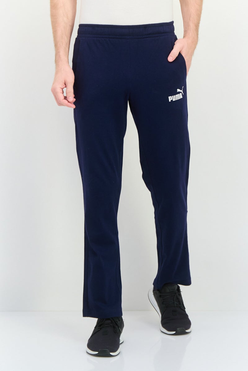 PUMA Men Sportswear Fit Drawstring Outdoor Track Pants, Navy/White - Image 1