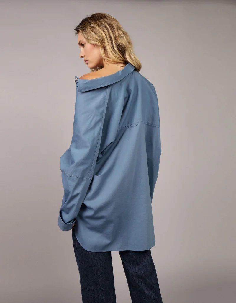 امريكان ايجل قميص فضفاض مزيّن بعبارة