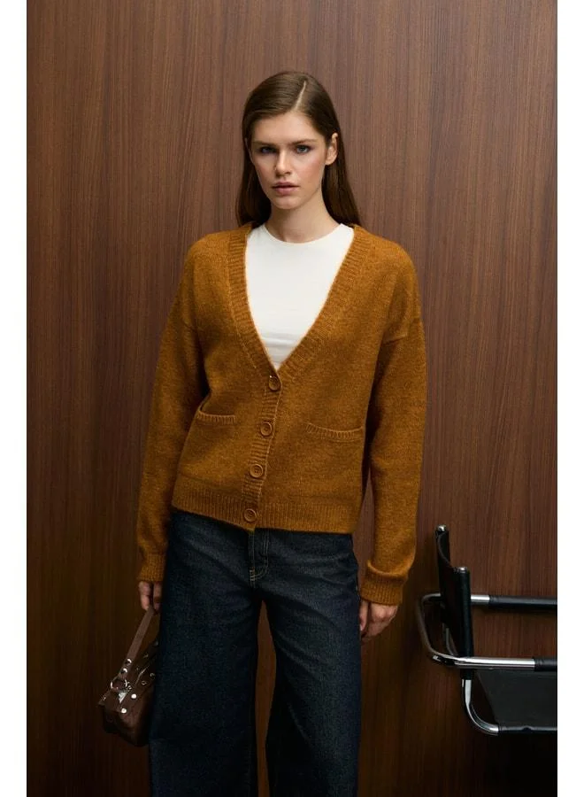 GRIMELANGE ESENCIA Women's V-Neck Long Sleeve Button Pocket Soft-Texture Regular Knit Saffron Yellow Sweater.