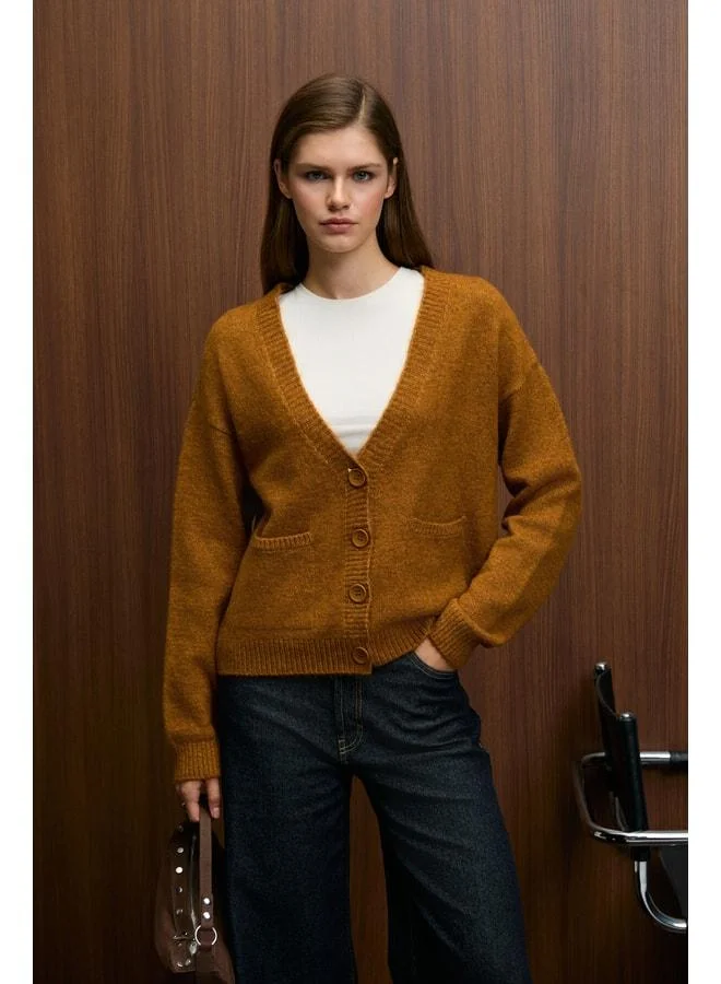 GRIMELANGE ESENCIA Women's V-Neck Long Sleeve Button Pocket Soft-Texture Regular Knit Saffron Yellow Sweater.