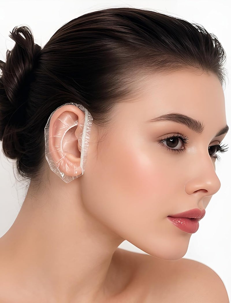 YTM Clear Ear Shower Caps 100Pcs Waterproof Plastic Disposable Covers for Hair Dye, Bathing, Salon, Spa, Swimming, Hotel, Home Use Comfortable Fit, Clear Water Barriers for Adults and Kids, Transparent - Image 1