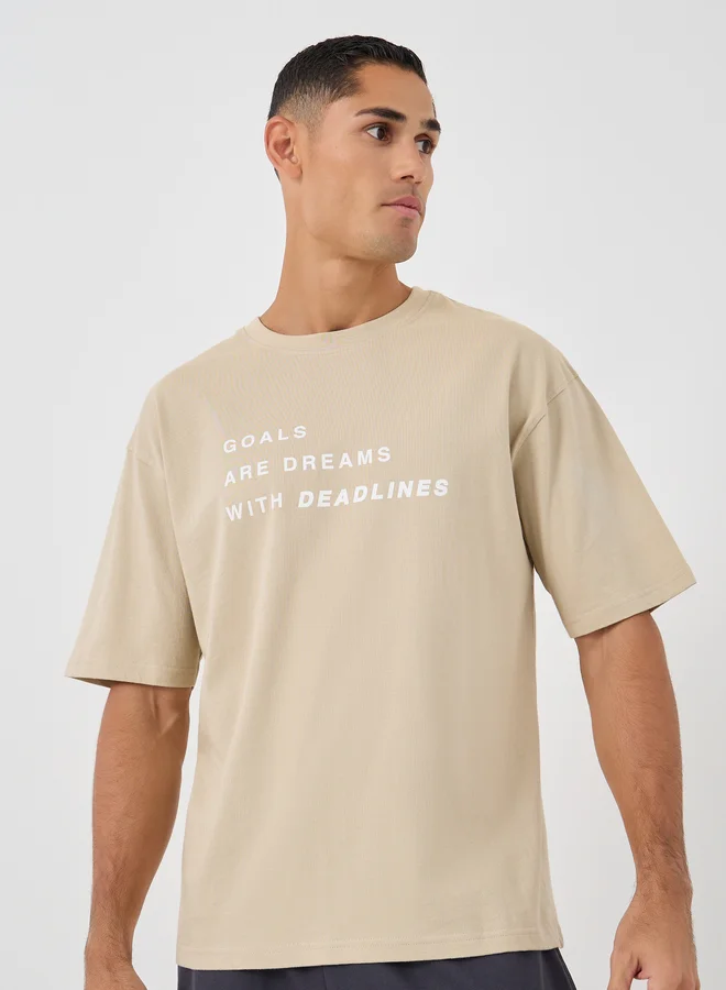 ستايلي Styli Men Beige Slogan Print Oversized T-Shirt and Shorts Co-Ords
