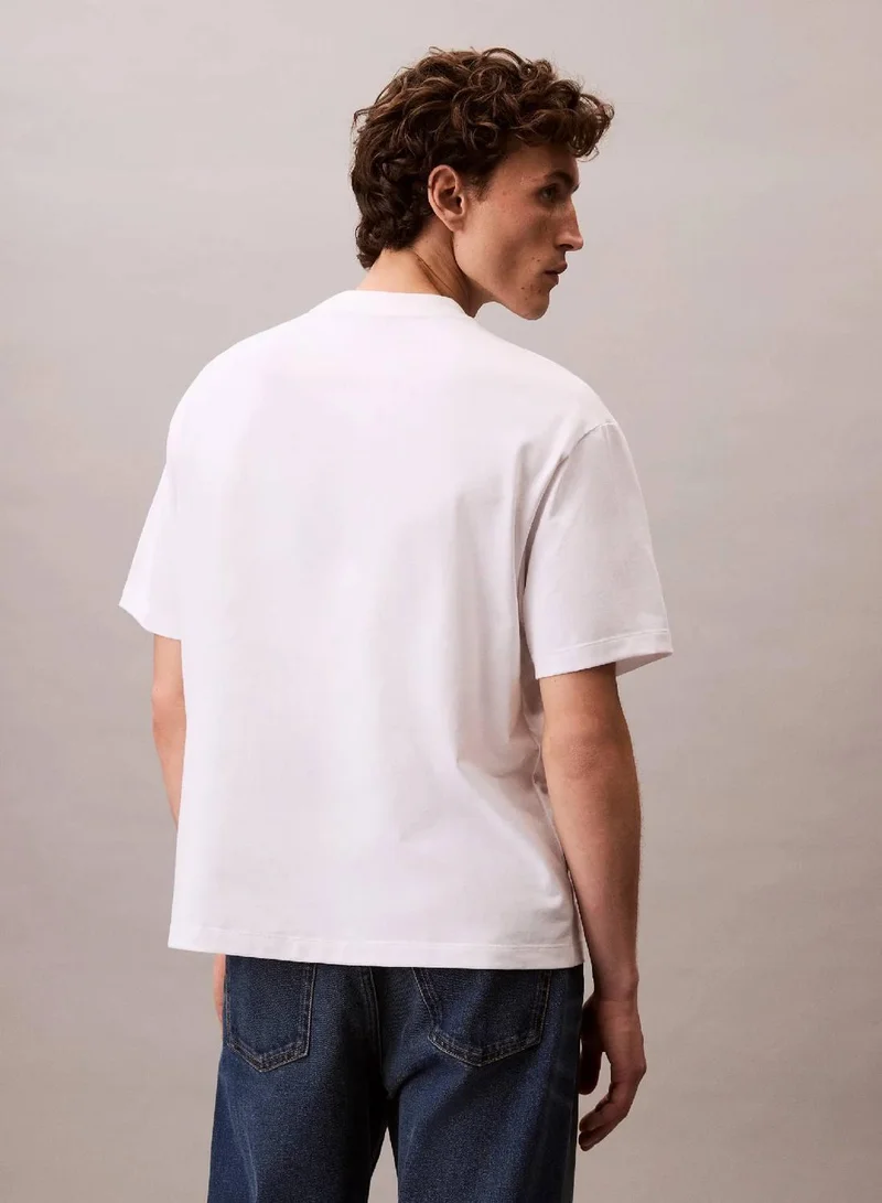 Calvin Klein Jeans Brilliant White Script Logo Graphic Relaxed T-Shirt for Men | Best Price UAE