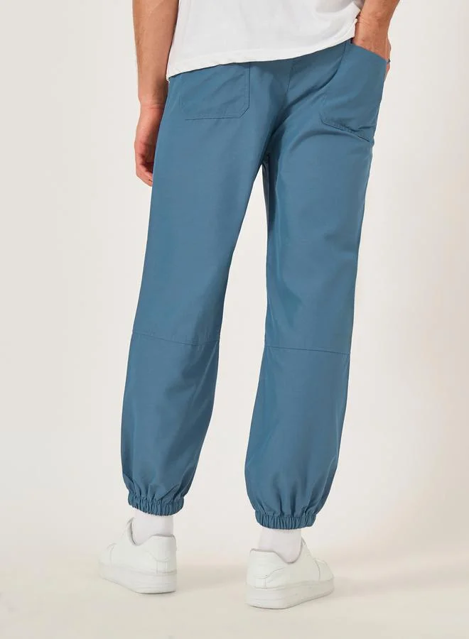 Take Two Solid Drawstring Waist Relaxed Fit Joggers by Styli