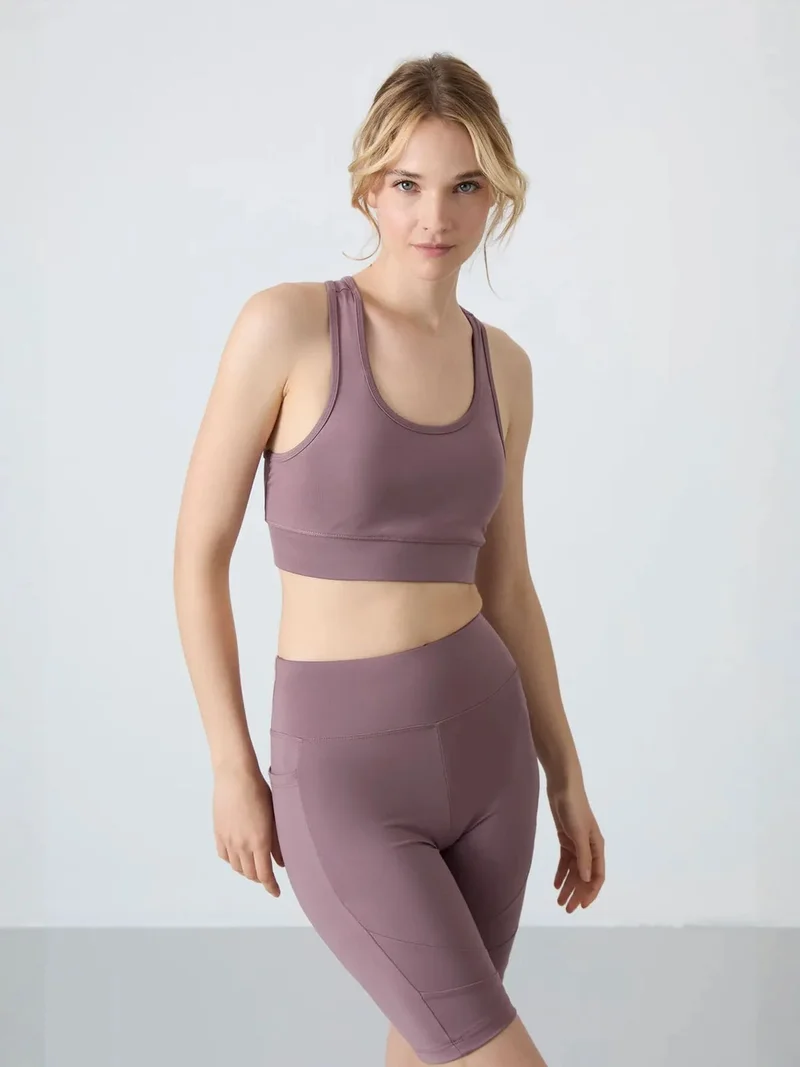 تومي لايف TOMMY Sleeveless Cropped Fitted Sports Top