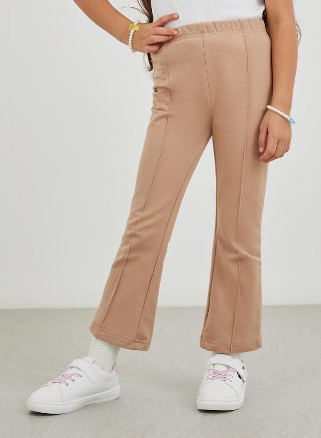 Styli Girls Beige Solid Pin Tuck Flared Leggings - Image 1