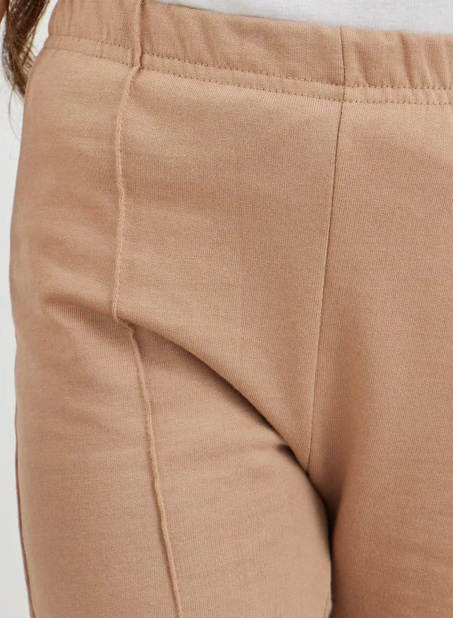 Styli Styli Girls Beige Solid Pin Tuck Flared Leggings