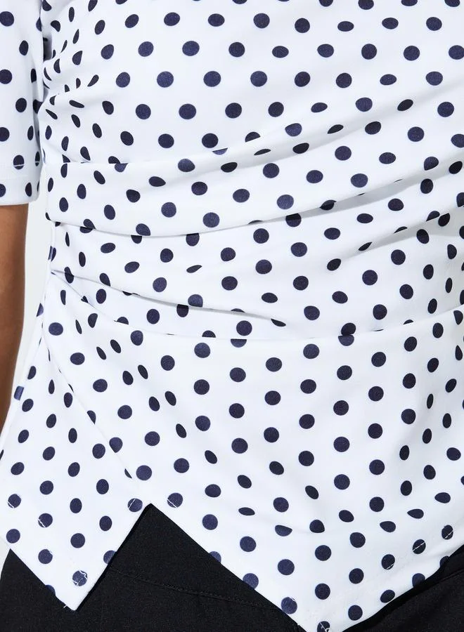 Styli  Off-White Polka Dot Asymmetric Hem Knit Top for Women | Best Price UAE