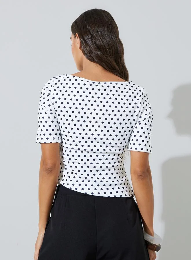 Styli  Off-White Polka Dot Asymmetric Hem Knit Top for Women | Best Price UAE