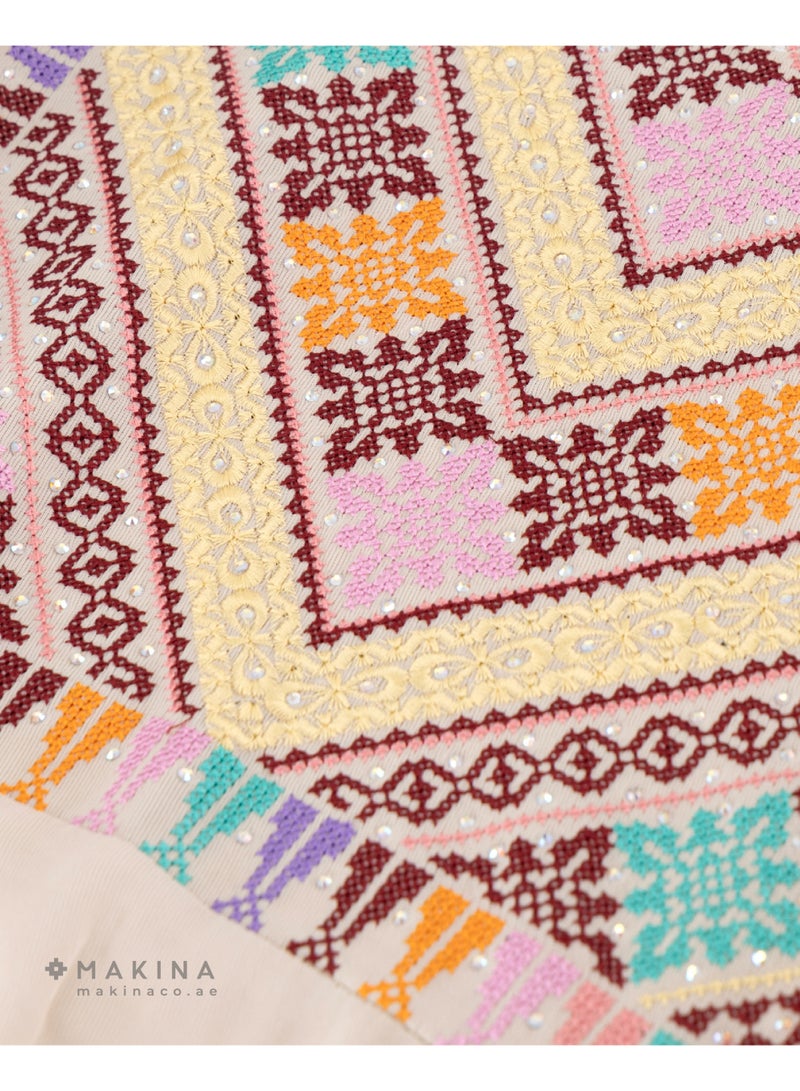 MAKINA A Half-Tallas Fallahi thobe crafted from premium Japanese Mubrad, featuring a rich fusion of Arabian embroidery patterns that reflect deep tradition and intricate artistry. This elegant garment is accented with cool satin for a subtle glow and a luxurious, silky touch. - Image 3