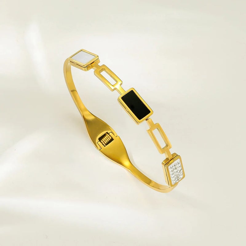 أسورة أستانليس ستيل ذهبي مرصعة بفصوص الزيركون