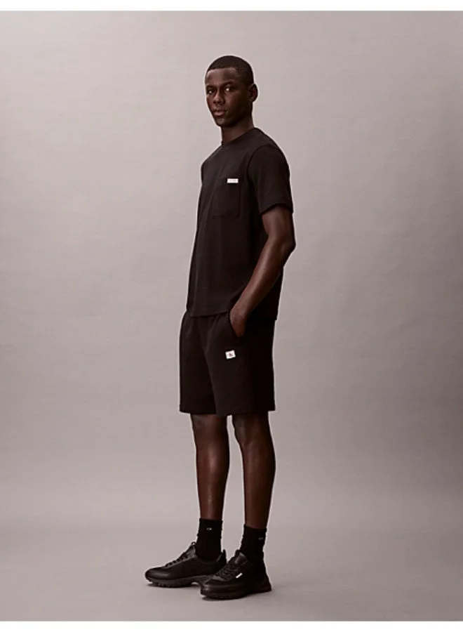 Calvin Klein Jeans Black Cotton Terry Badge Jogger Shorts for Men | Best Price UAE
