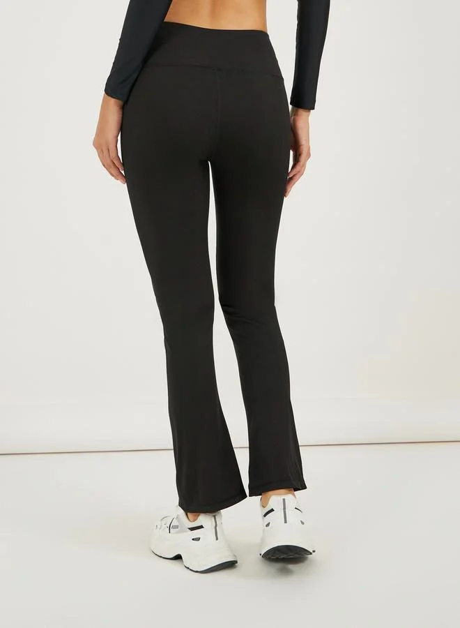 Styli Broad Waistband Ankle Zip Up Detail Flared Pants