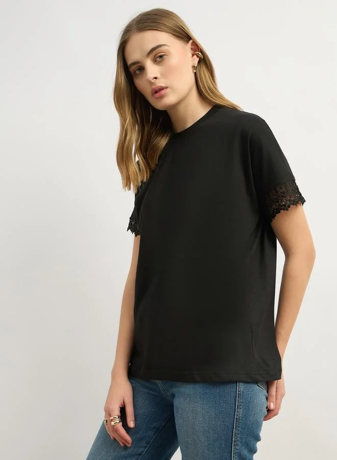 Styli Solid Round Neck Boxy Fit T-Shirt with Lace Trim Detail
