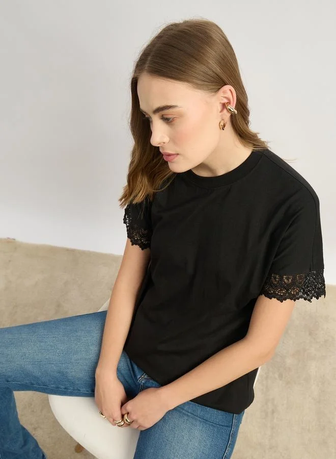 Styli Solid Round Neck Boxy Fit T-Shirt with Lace Trim Detail
