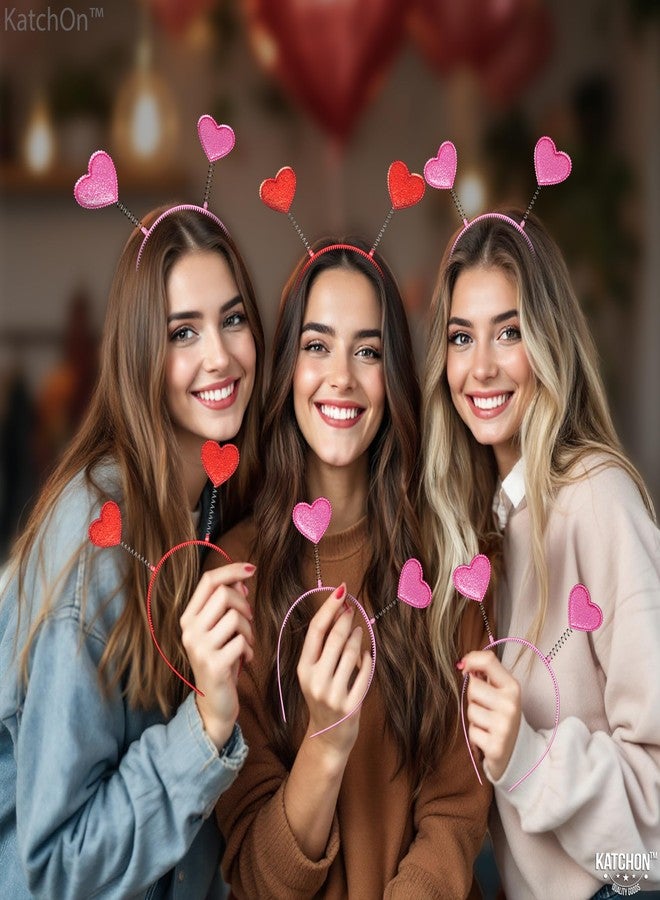 كاتشون، عصابات رأس على شكل قلوب وردية وحمراء - عبوة من 12 قطعة | عصابات رأس لعيد الحب للنساء لتزيين عيد الحب وحفلات الزفاف | عصابة رأس على شكل قلب، عصابة رأس للهالوين | زينة حفلات عيد الحب - Image 4