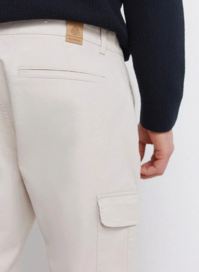 Springfield  Cargo trousers in stretch cotton fabric for greater comfort. Two side pockets on both legs, with flap and hidden button fastening. Comfort slim fit. for Men | Best Price UAE