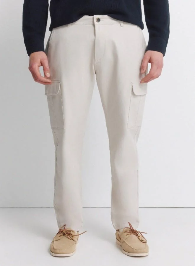 Springfield  Cargo trousers in stretch cotton fabric for greater comfort. Two side pockets on both legs, with flap and hidden button fastening. Comfort slim fit. for Men | Best Price UAE