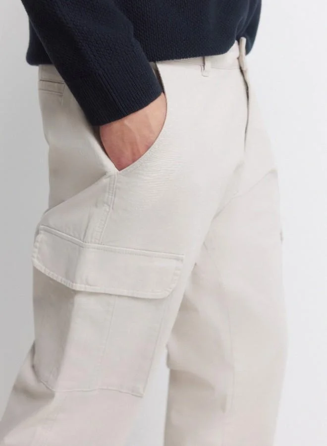 Springfield  Cargo trousers in stretch cotton fabric for greater comfort. Two side pockets on both legs, with flap and hidden button fastening. Comfort slim fit. for Men | Best Price UAE