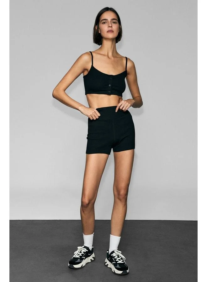 URBAN BEAT ZERRA Women’s Soft and Flexible Fabric Black Sports Bra with Printed Details, Straps and Buttons.