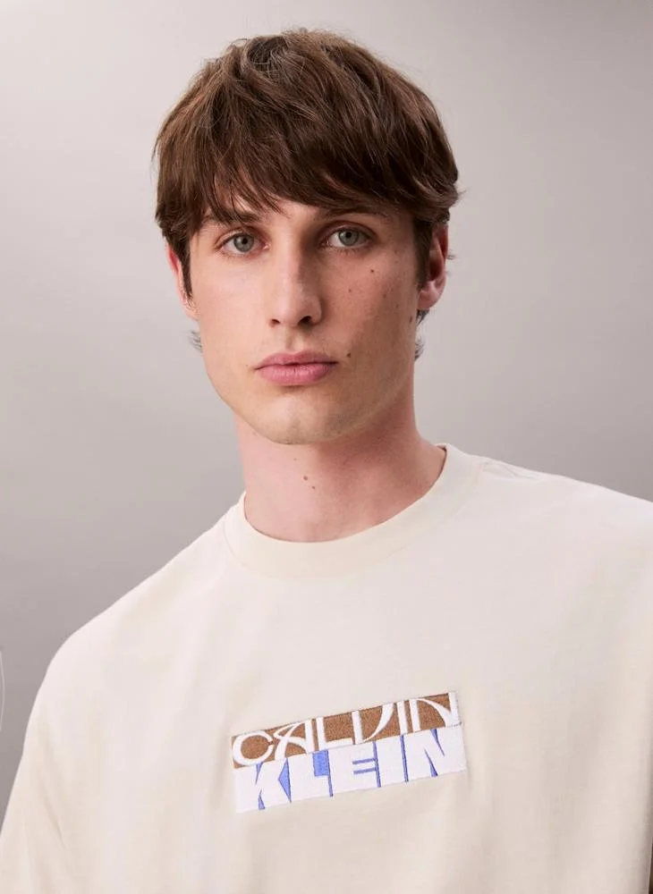Calvin Klein Jeans  Block Logo Graphic Relaxed T-Shirt for Men | Best Price UAE