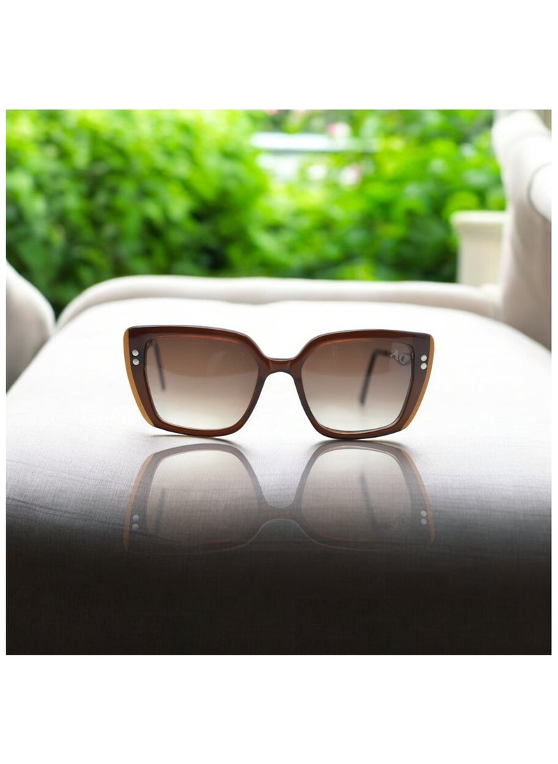 Armando Cavelli - Authentic Armando Cavelli sunglasses, crafted from carefully selected premium acetate for a luxurious look and longevity with extensive use. This model combines modernity and classic style, with a raw brown acetate front and brown -plated metal temples to complete your luxury look. Comes with premium polymer lenses offer UV400 protection in a gradient brown. - Image 1