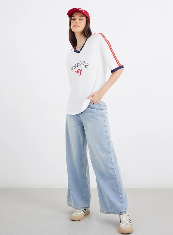 Styli Styli Women Off White Slogan Print V Neck Oversized T-Shirt
