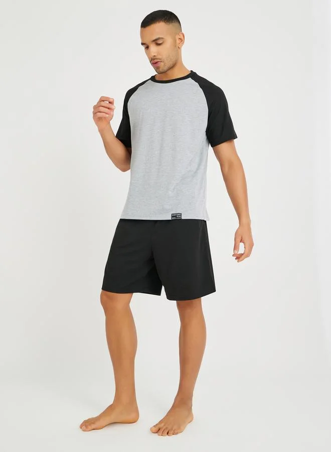 Styli Styli Slogan Back Print Raglan Sleeves T-Shirt and Shorts Set