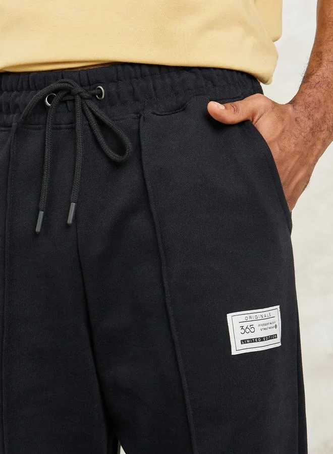 Styli Fleece Pintuck Wide Leg Jogger with Badge Detail