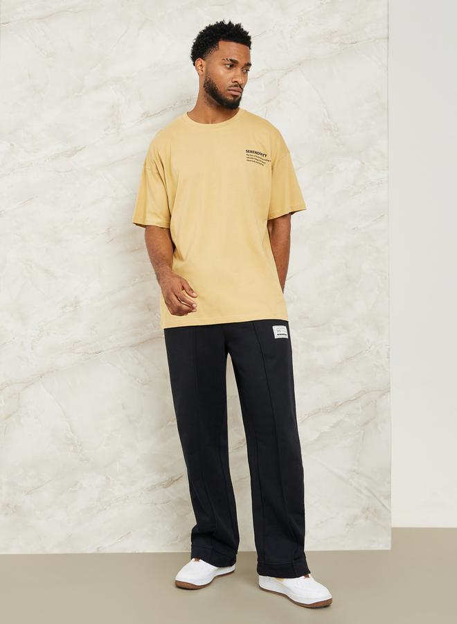 ستايلي بنطال رياضي واسع الساق من الصوف بنقوش مزمومة مع تفاصيل شارة - Image 2