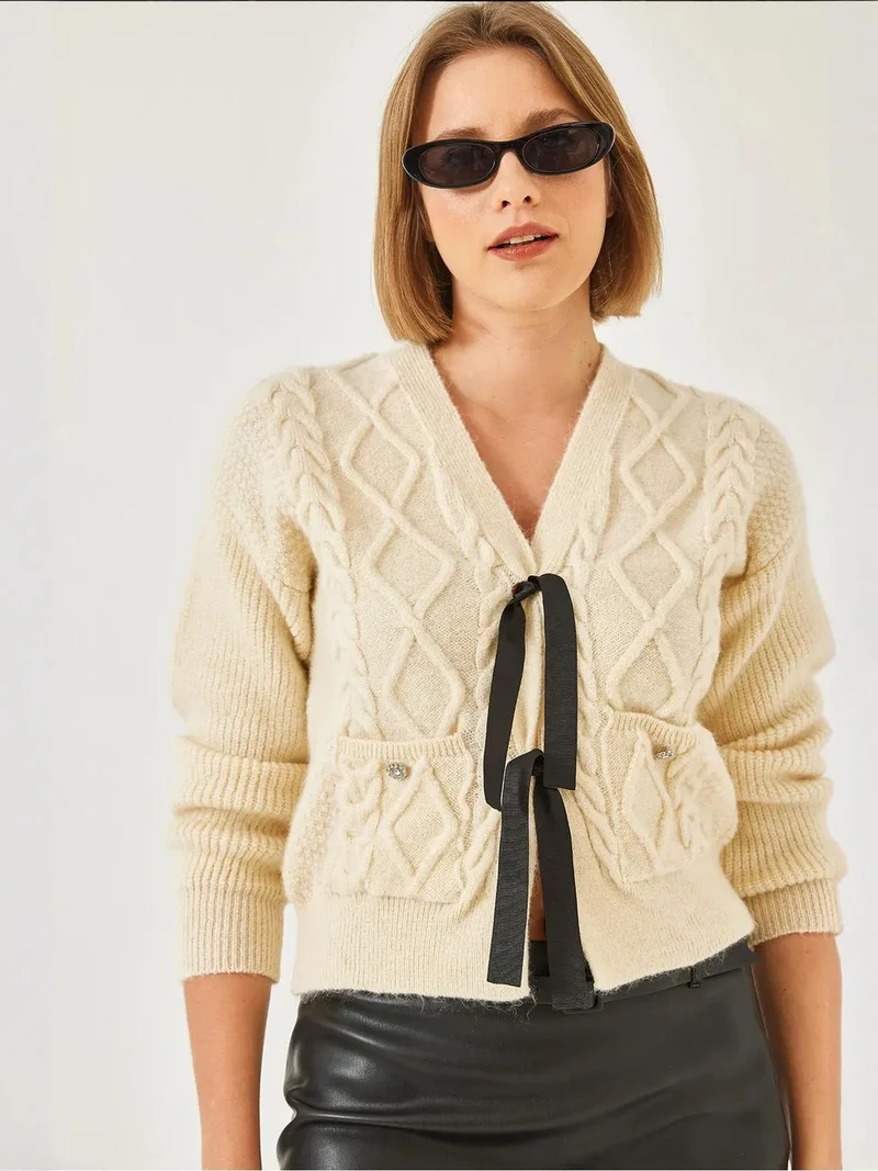 Bianco Lucci LUCCI Textured V-Neck Cropped Cardigan with Pompom