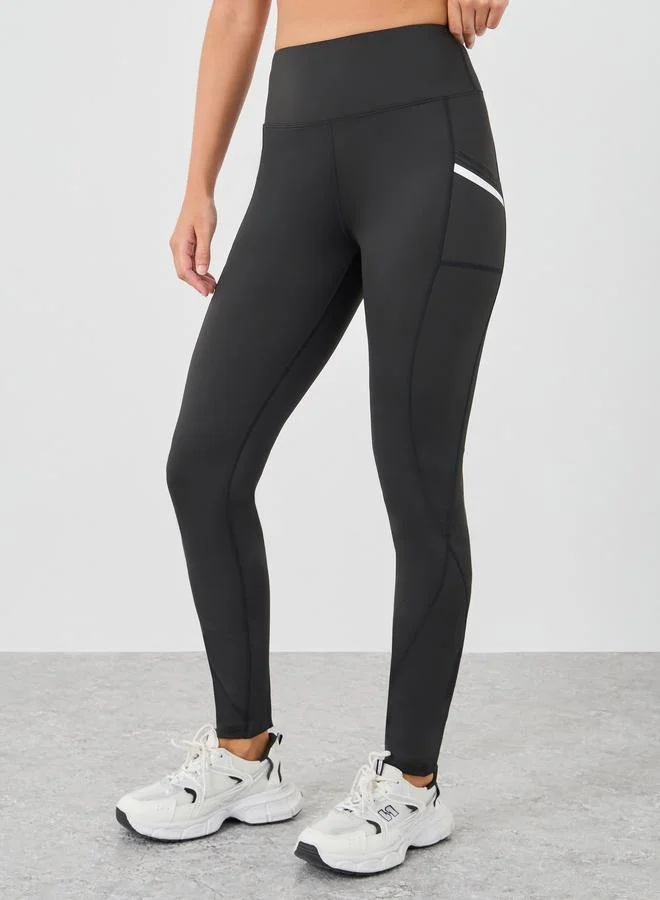 ستايلي اكتيف بنطلون ليجنز بخصر جانبي وجيب وتفاصيل عاكسة وحافة خام