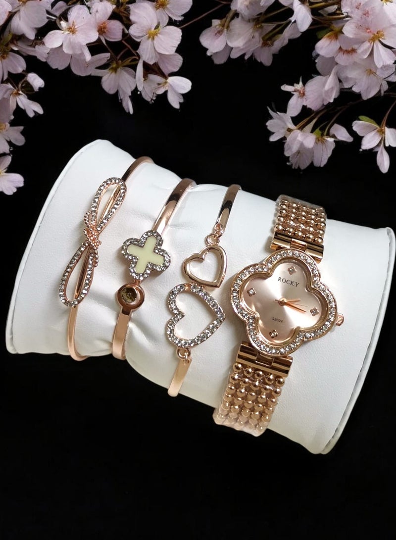 روكي طقم نسائي ذهبي ماركة روكي يتكون من ساعة ومجموعة من الاساور من الستانلس ستيل - Image 1