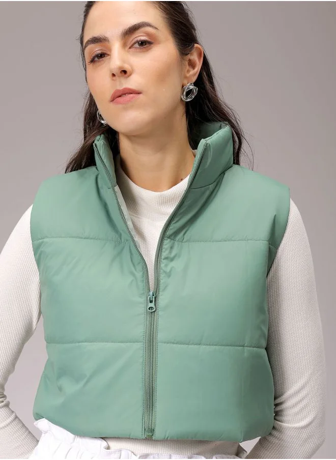 مرفوعة Women Regular Green Solid High Neck Sleeveless Outerwear