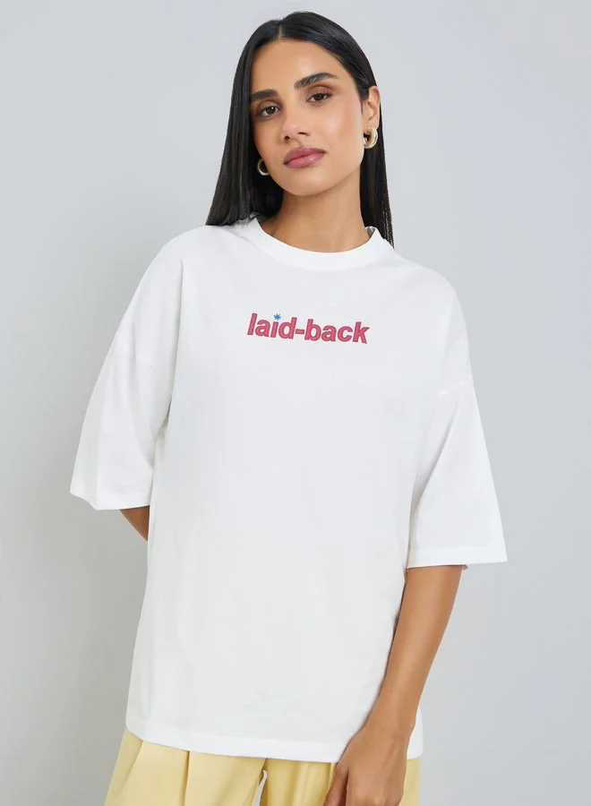 Styli Cream Laid-Back Front and Back Puff Print 100% Cotton Oversized T-Shirt