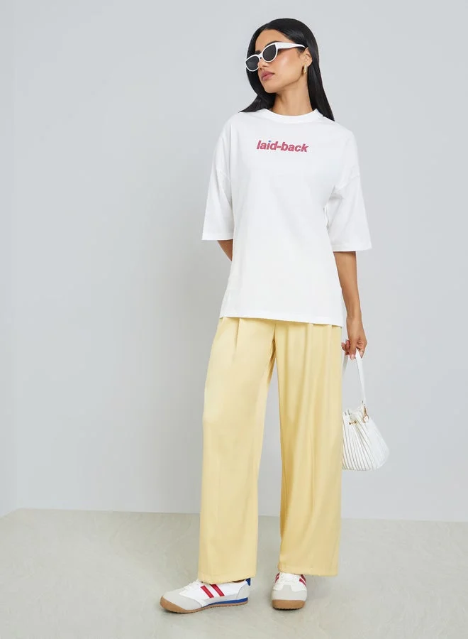 Styli Cream Laid-Back Front and Back Puff Print 100% Cotton Oversized T-Shirt