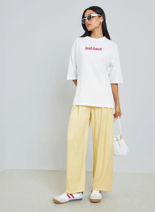 Styli Cream Laid-Back Front and Back Puff Print 100% Cotton Oversized T-Shirt