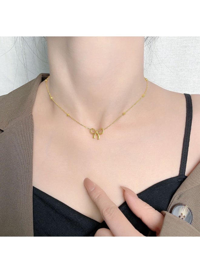 يوكانبي طقم مجوهرات أنيق من ٤ قطع للنساء – عقد، سوار، حلق وخلخال بتصميم فيونكة | من التيتانيوم باللون الذهبي - Image 5