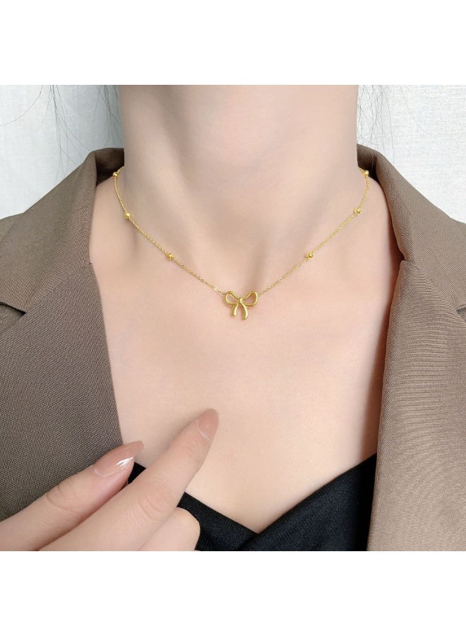 يوكانبي طقم مجوهرات أنيق من ٤ قطع للنساء – عقد، سوار، حلق وخلخال بتصميم فيونكة | من التيتانيوم باللون الذهبي - Image 2