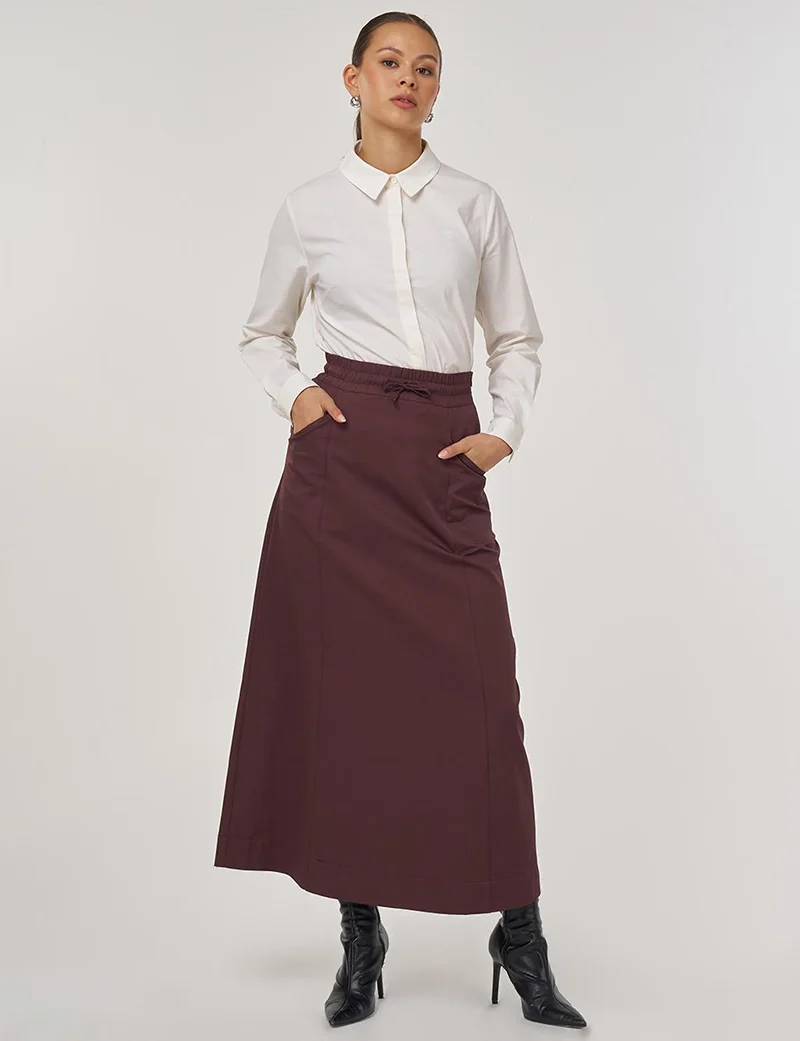 كايرا تنورة واسعة بتفاصيل جيب باللون البرغندي الداكن
